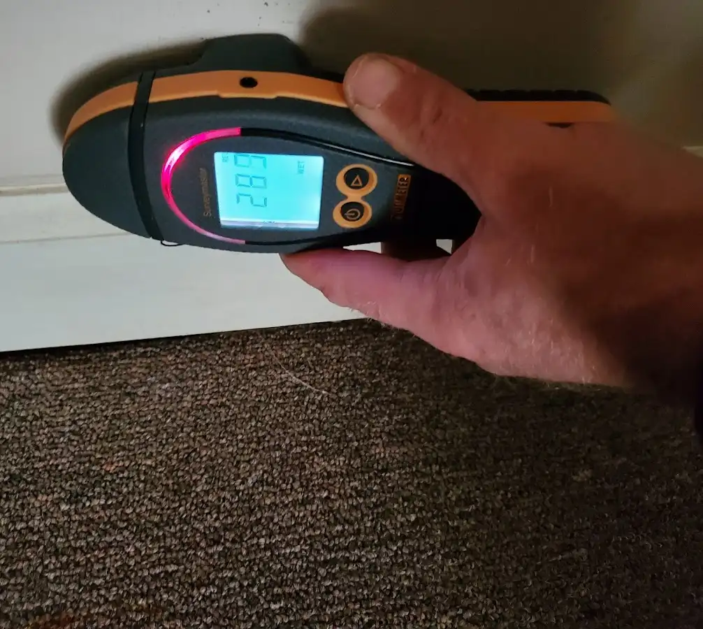 Moisture detection at baseboard during Burst Pipe Cleanup in Harrisonville